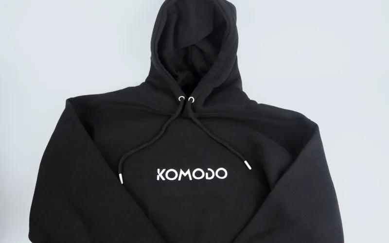A black hoodie featuring the word 