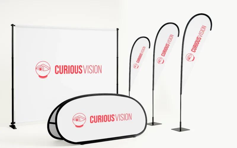 A display setup featuring banners and a pop-up sign with the logo 