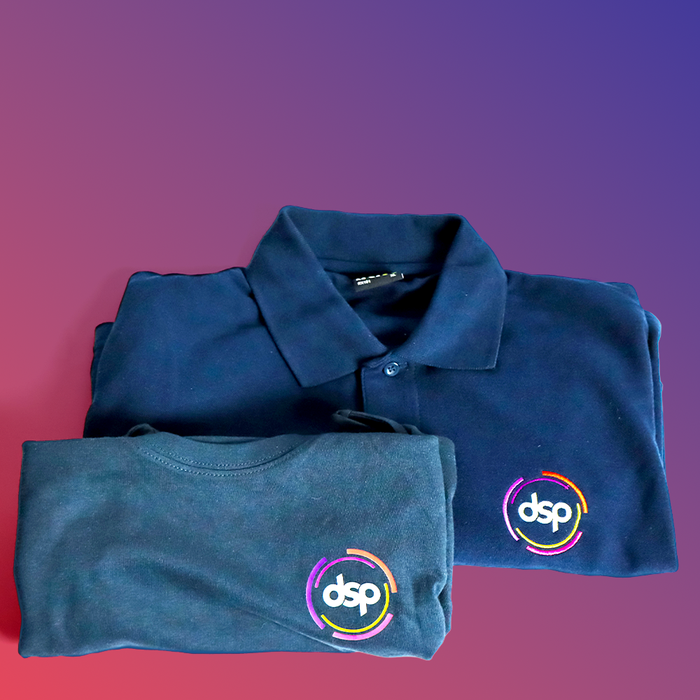 A navy polo shirt and a navy t-shirt, both featuring the logo 