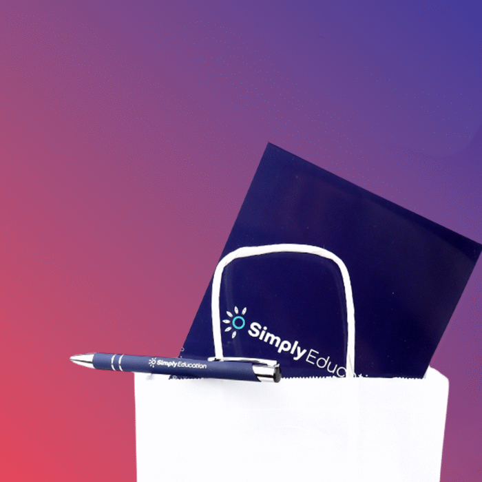 A white bag with a navy blue folder and a pen featuring the logo of 