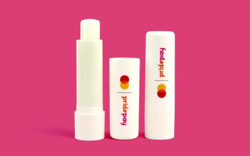 Three lip balm tubes in white packaging with the 