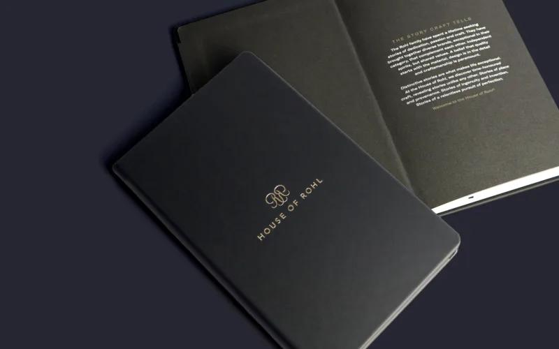 A black booklet titled 