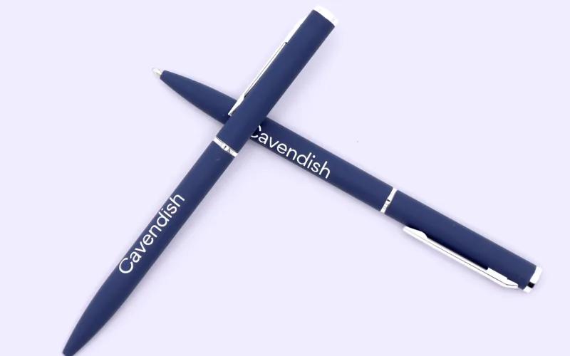 Two navy blue pens with the word 
