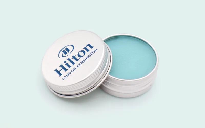 A tin with a lid, labeled 