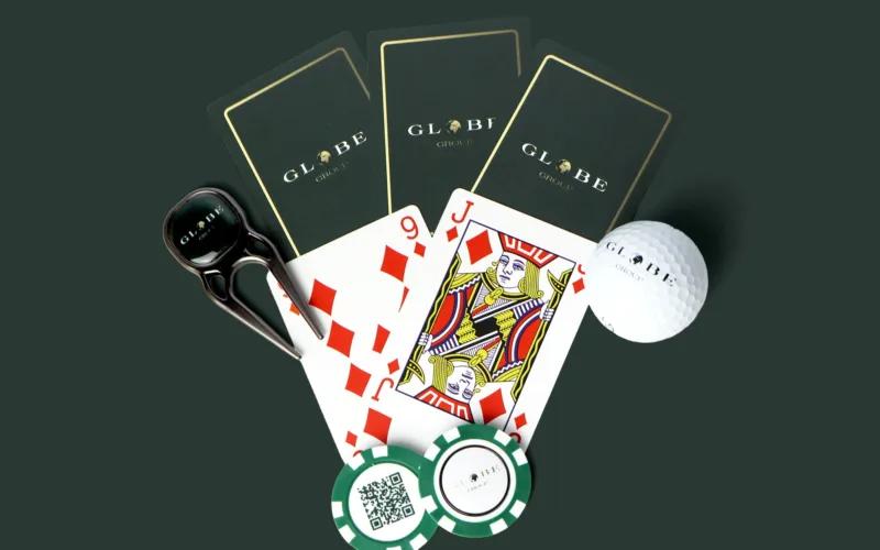A collection of items including three green cards branded 