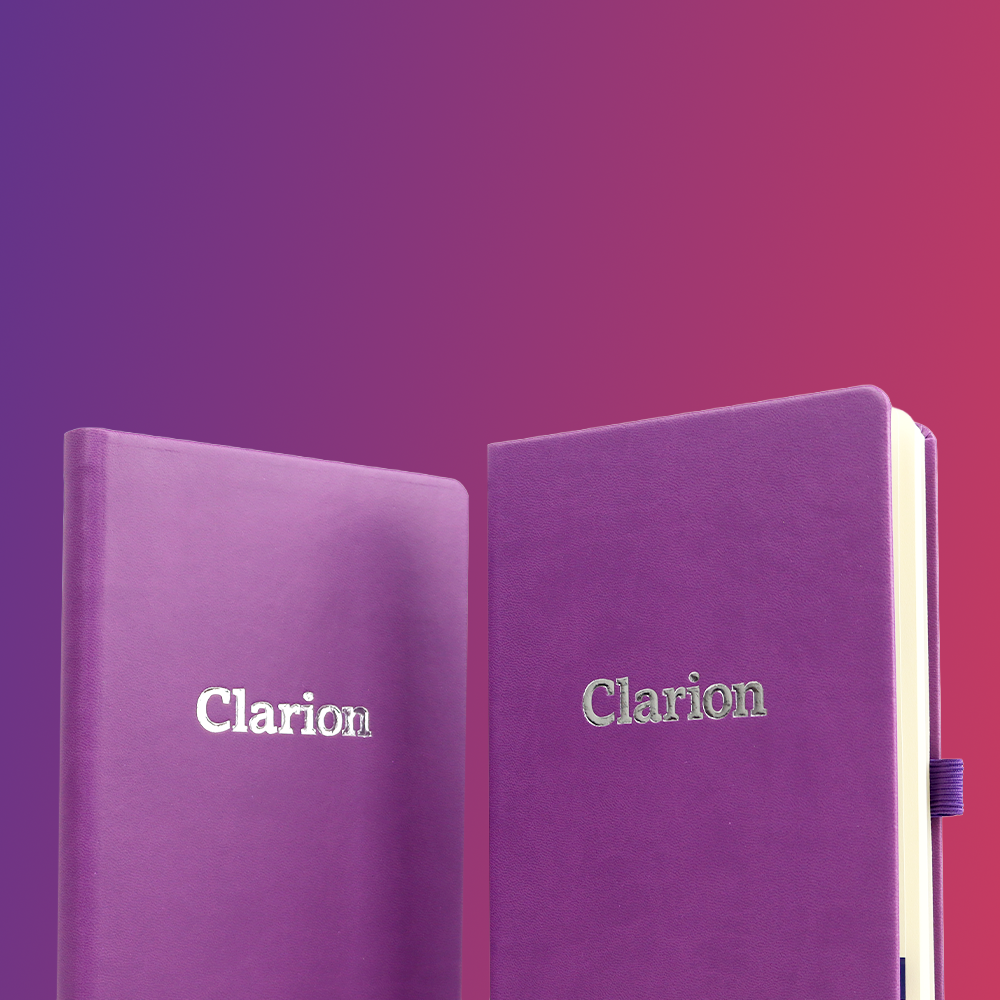 Two purple notebooks with the word 