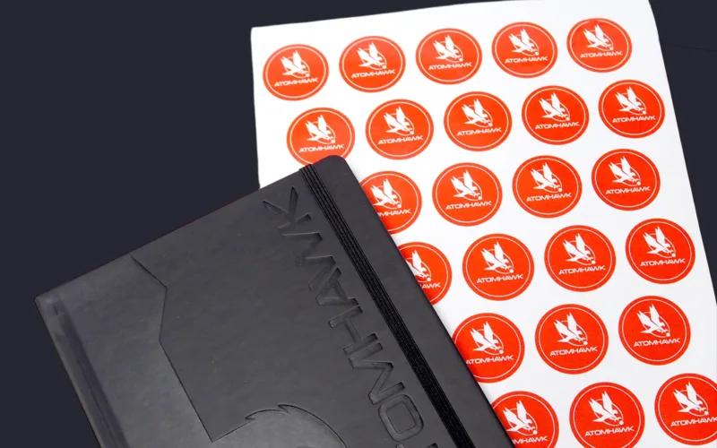 A black notebook with the embossed text 