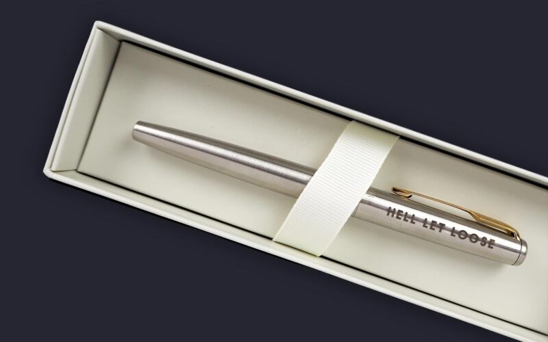 A silver pen with the engraving 