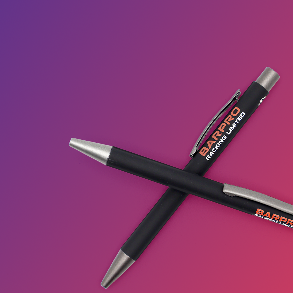 Two black pens with silver tips, positioned diagonally across each other, against a gradient purple background.